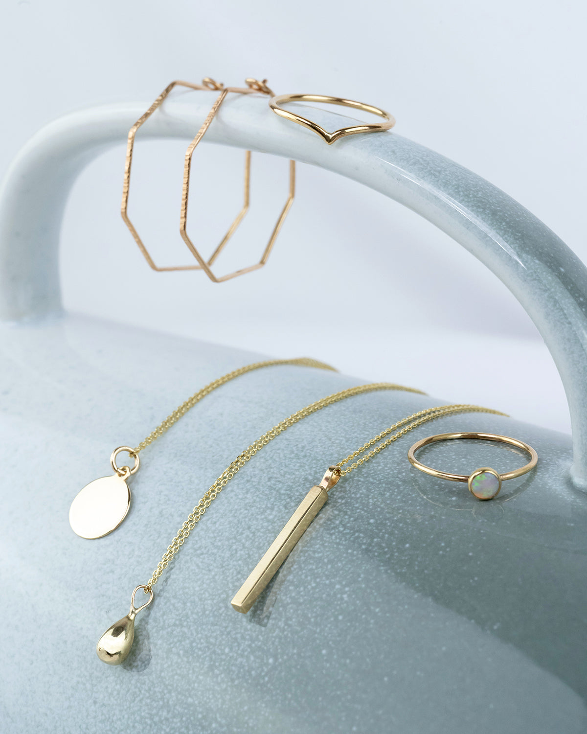 A display of solid gold jewellery made by independent designers, including rings, necklaces and earrings